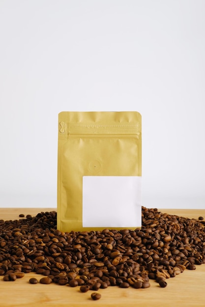 Photo brown coffee packaging stand on top of coffee packaging with white background