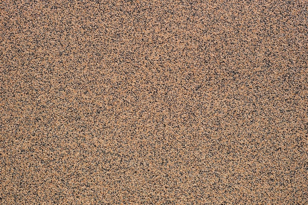 Brown concrete texture with small pebbles