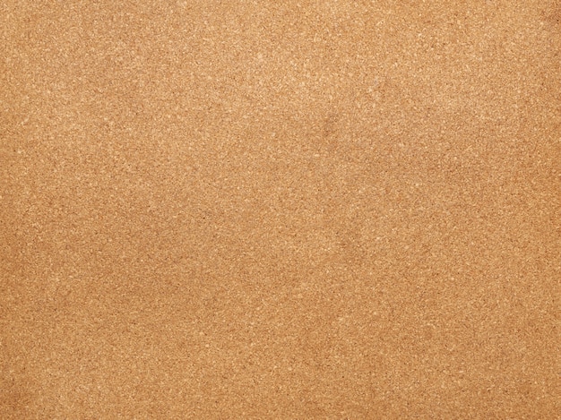 Photo brown cork board texture for stickers, full frame, close up