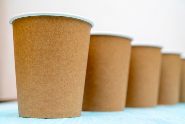 Brown disposable paper cups for drinks.