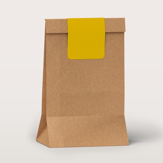 Photo brown eco bag with yellow sticker isolated on white background