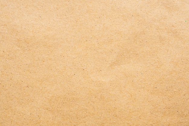 Brown eco recycled kraft paper sheet texture cardboard background