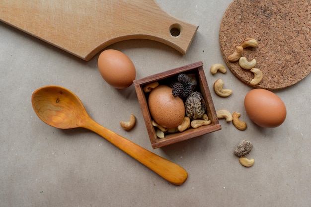 Brown eggs on wood and craft paper background