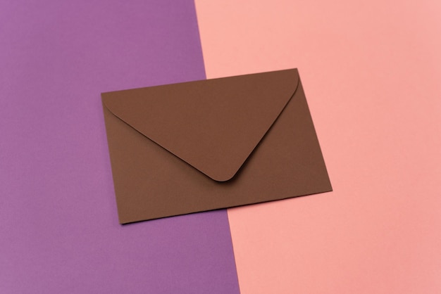 Photo brown envelope on a two colored pink and purple background