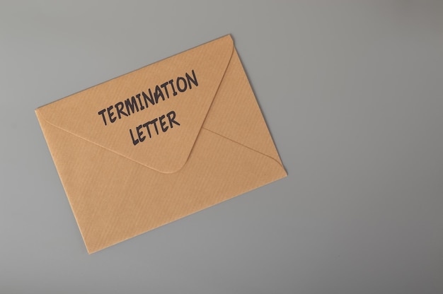 Brown envelope written with TERMINATION LETTER Unfair dismissal concept