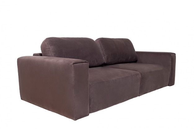 白で隔離される枕と茶色の布製ソファ。モダンな家具