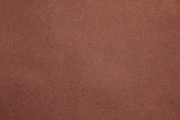 Brown fabric texture background closeup