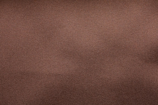 Brown fabric texture background closeup