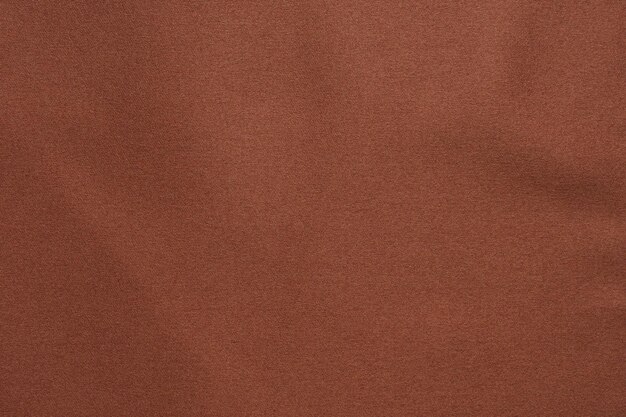 Brown fabric texture background closeup