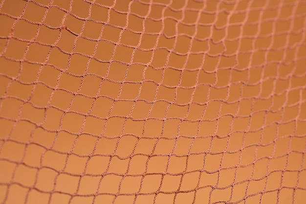 Brown fishing net, on soft brown background