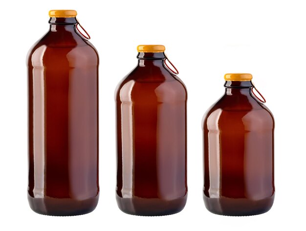 Brown glass beer bottle with yellow cap on white background