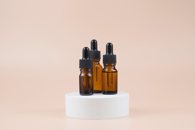 Brown glass bottles with serum, essential oil or other cosmetic product