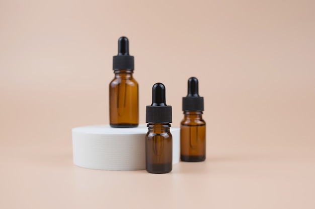 Brown glass bottles with serum, essential oil or other cosmetic product.