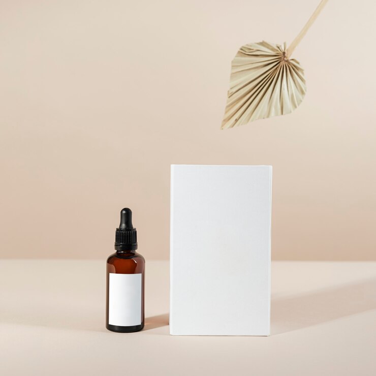 Photo brown glass dropper bottle with a white box product