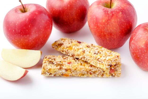 Brown granola bars and red apples