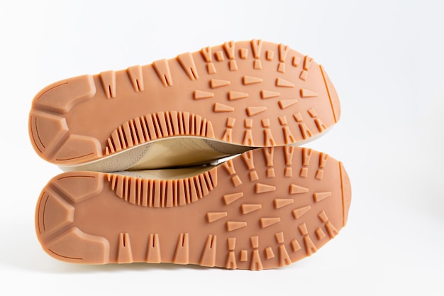 Brown grooved sole sneaker on a white background