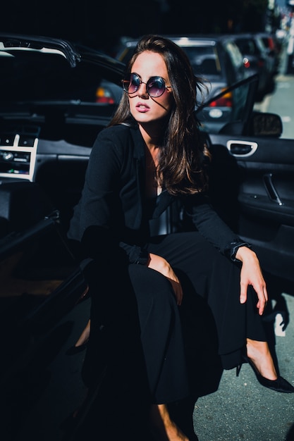 Brown Hair Sexy Woman On The Seat Of The Car