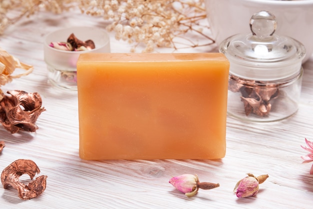 Brown handmade soap on wooden background