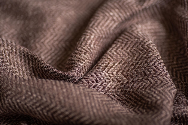 Brown Herringbone Fabric Close Up Klassiek Zigzagpatroon in gevouwen textiel