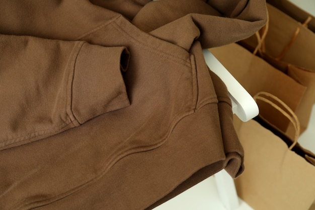 Brown hoodie and paper bags