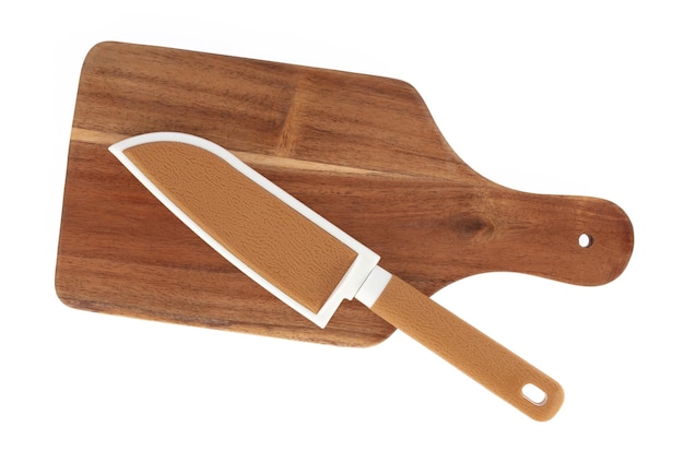 Brown knife with a brown knife sheath on wood cutting board