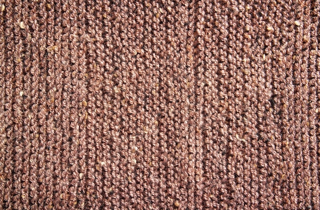 Текстура шерсти коричневого вязания для фона