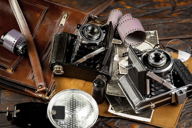 A brown leather case with a camera and a camera on it