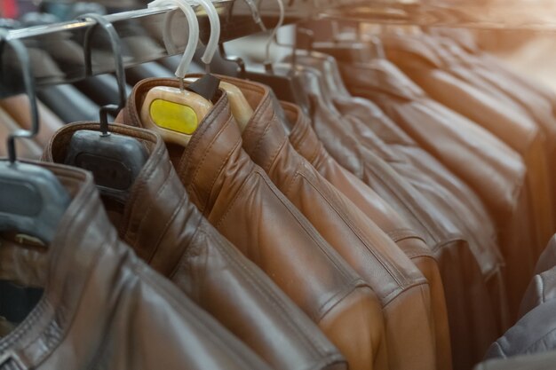 Photo brown leather jackets on the rack