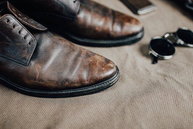 Brown leather retro shoes belt steampunk sunglasses and a pocket watch Vintage style