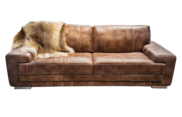 Brown leather sofa with animal skin isolated white background