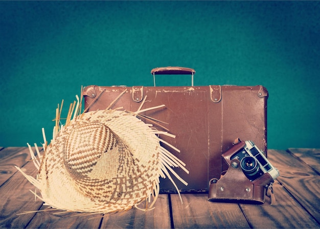 Brown leather vintage suitcase and camera