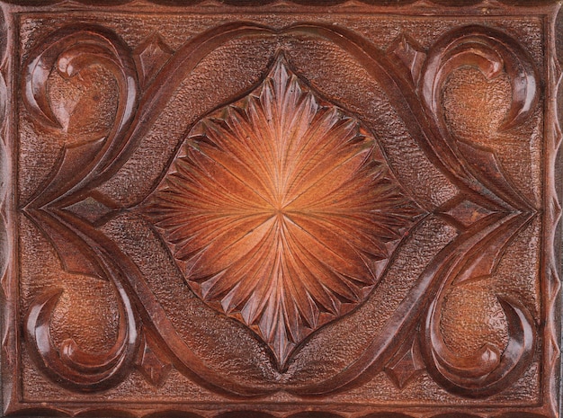 A brown leather wall panel with a sunburst design.