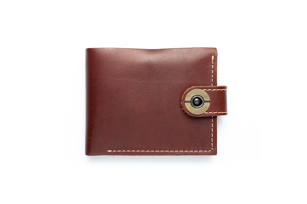 Brown leather wallet on a button on a white background Top view