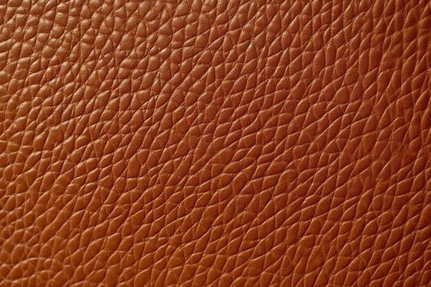 A brown leather with a pattern of lines in the corners.