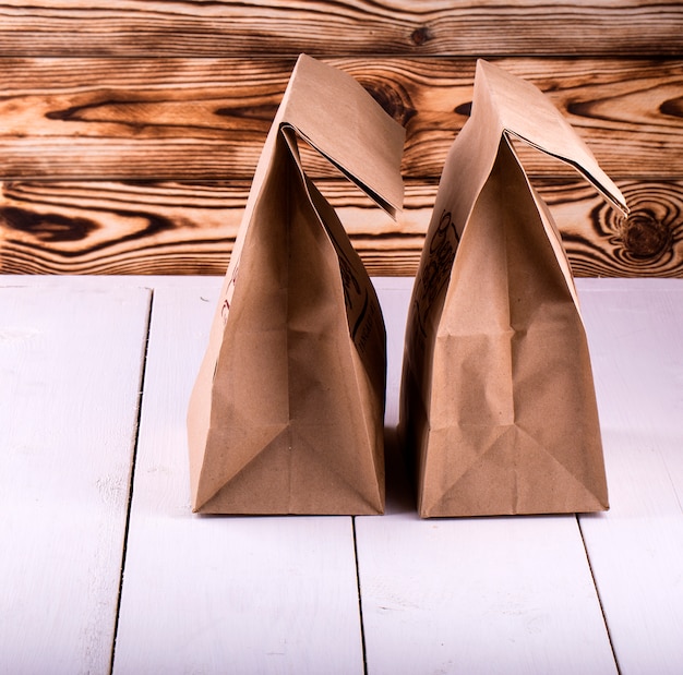 Brown Lunch Bag on white wooden table