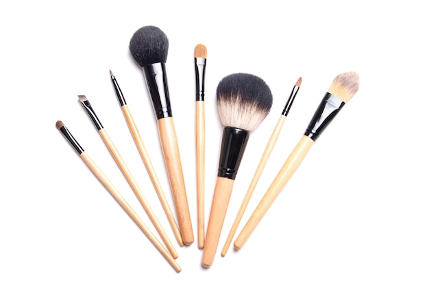 Brown makeup brushes isolated on white