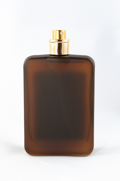 Brown matte bottle of perfume for men on white background