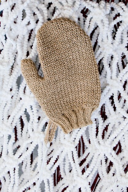 Photo brown mitten on a white background in the view