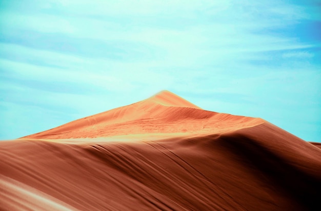 A brown mountain under sky.