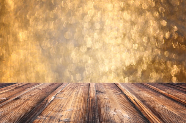 Brown old wooden floor on Christmas bokeh backdrop.