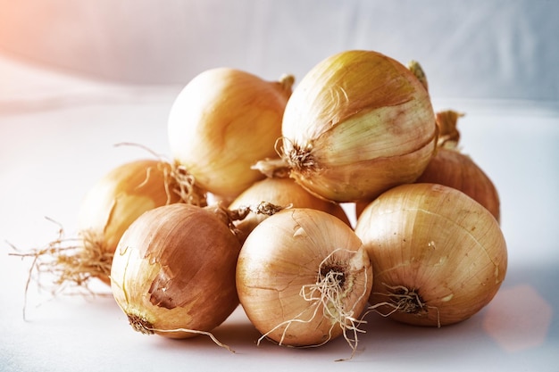 Brown onions isolated on white background