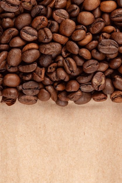 A brown paper background with coffee beans and a brown paper background