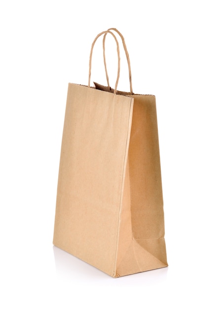 Brown paper bag on white wall