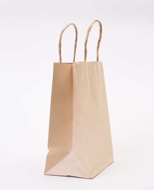 Brown paper bag on white