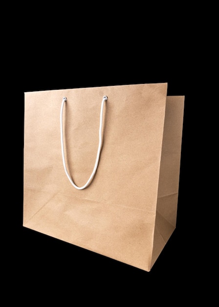Brown paper bag with empty blank space for design mockup isolated on black background Clipping path For advertising