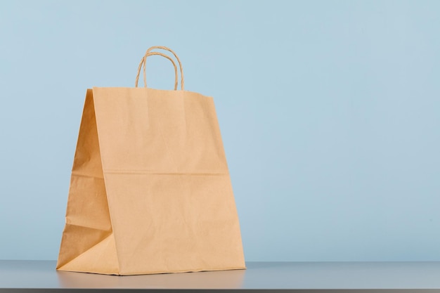 Brown paper bag with handles empty shopping bag with area for
your logo or design food delivery concept