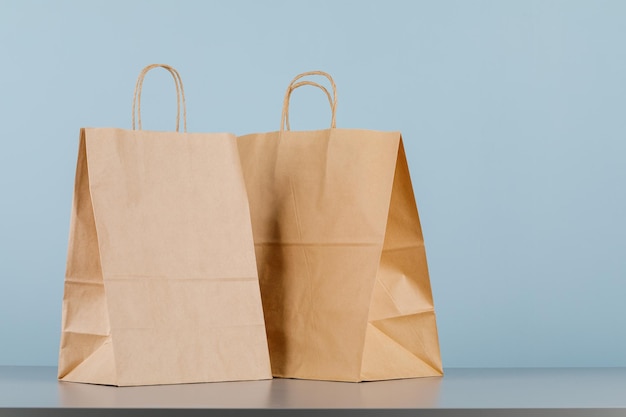 Brown paper bag with handles empty shopping bag with area for your logo or design food delivery concept