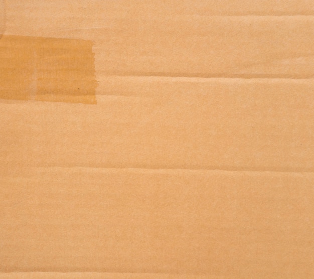 Brown paper box or corrugated cardboard sheet texture background.