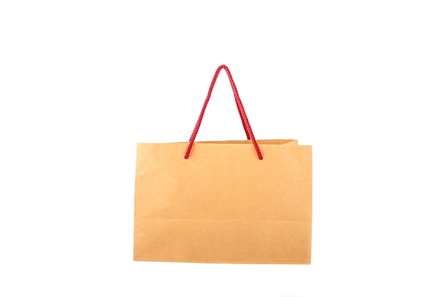 Brown paper shopping bag with red handle robe isolated on white background