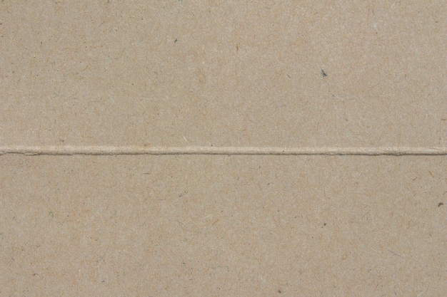 A brown paper with a line drawn on it